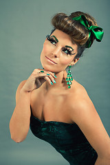 Image showing brunette woman with green jewelery and accssesoires