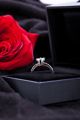 Image showing red rose and diamond ring in a box 