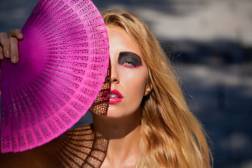 Image showing young beautiful woman with smokey eyes and pink lips