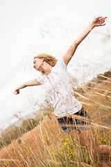 Image showing young happy attractive woman arms wide open 