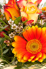 Image showing Vivid orange gerbera daisy in a bouquet