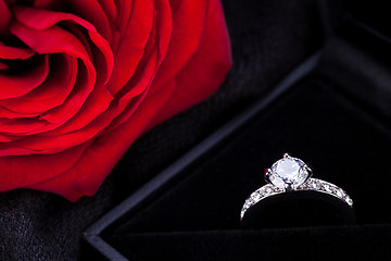 Image showing red rose and diamond ring in a box 