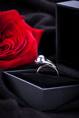 Image showing red rose and diamond ring in a box 