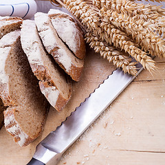 Image showing homemade fresh baked bread and knife 