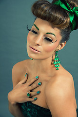 Image showing brunette woman with green jewelery and accssesoires