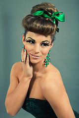 Image showing brunette woman with green jewelery and accssesoires