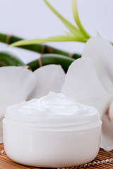 Image showing cosmetic face cream on wooden background 