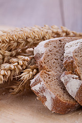 Image showing homemade fresh baked bread and knife 