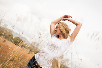 Image showing young happy attractive woman arms wide open 