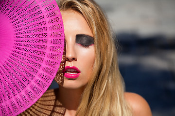 Image showing young beautiful woman with smokey eyes and pink lips