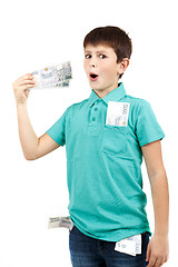 Image showing amazed boy looks at the bill