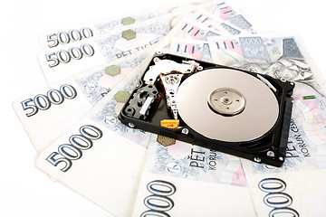 Image showing The open hard disk, with czech money banknotes