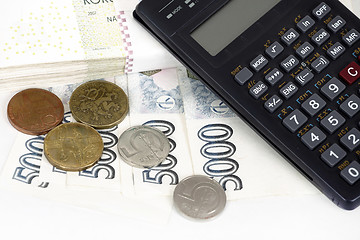 Image showing Czech money banknotes, coins and calculator