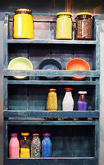 Image showing Shelf full of bottles of beads and craft supplies