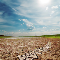 Image showing cloudy sky over drought land
