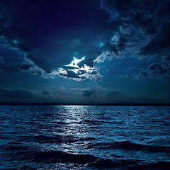 Image showing moon light over darken water in night