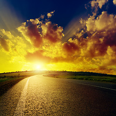 Image showing fantastic sunset over asphalt road