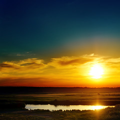 Image showing blue and orange sunset over lake