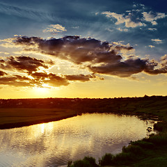 Image showing cloudy sunset over river