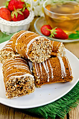 Image showing Cookies honey with strawberry and tea on board