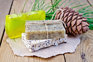 Image showing Soap different with cedar cones on a board