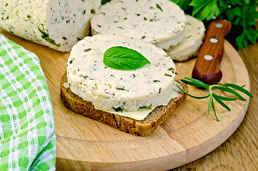 Image showing Sandwich with homemade cheese and butter on board