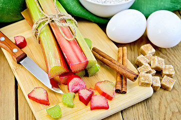 Image showing Rhubarb with sugar and eggs on the board