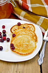 Image showing Flapjacks with cranberry in a plate on a board