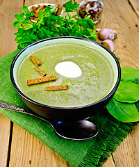 Image showing Puree of spinach with croutons on the board