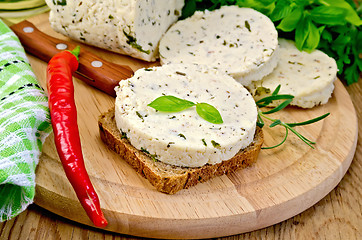 Image showing Sandwich with homemade cheese and pepper on the board