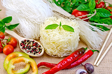 Image showing Noodles rice different with peppers and vegetables on sacking