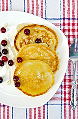 Image showing Flapjacks with cranberry in a plate on a napkin