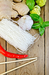 Image showing Noodles rice thin white with broccoli on the board