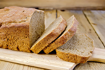 Image showing Rye homemade bread sliced on the board