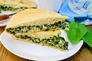 Image showing Pie with spinach and cheese on the board