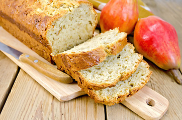 Image showing Fruitcake with pears on a board