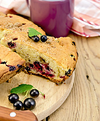 Image showing Pie with berries of black currant on a board