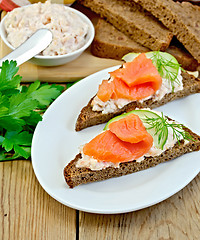Image showing Sandwich with cream and salmon in the dish with dill