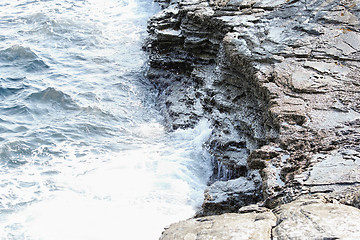 Image showing rocky beach and huge waves