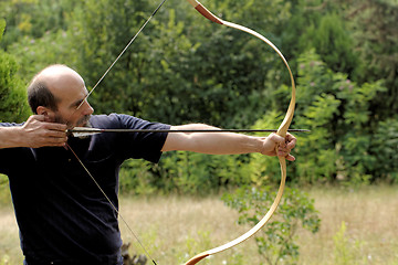 Image showing man shooting with bow