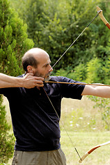 Image showing man shooting with bow