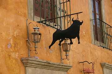 Image showing Bull outside Mexican restaurant