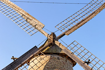 Image showing Old wooden mill against the blue sky