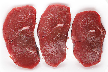 Image showing Minute steaks in a butchers tray