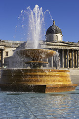 Image showing Fountain in Trafalgar square with national portrait gallery in the background