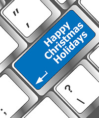 Image showing happy christmas holidays button on computer keyboard key