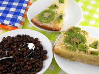 Image showing kiwi cake on white plate with coffee beans