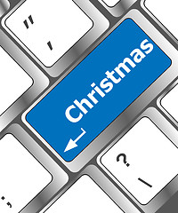 Image showing christmas button on the keyboard key - holiday concept