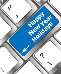 Image showing happy new year holidays button on computer keyboard key