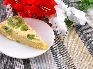 Image showing cake with fruits with red and white flowers